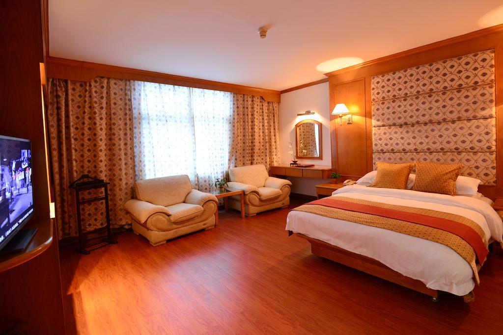 Baodao Exhibition Center Hotel Уйишань Номер фото