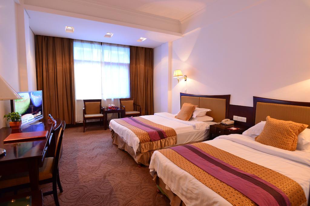 Baodao Exhibition Center Hotel Уйишань Номер фото