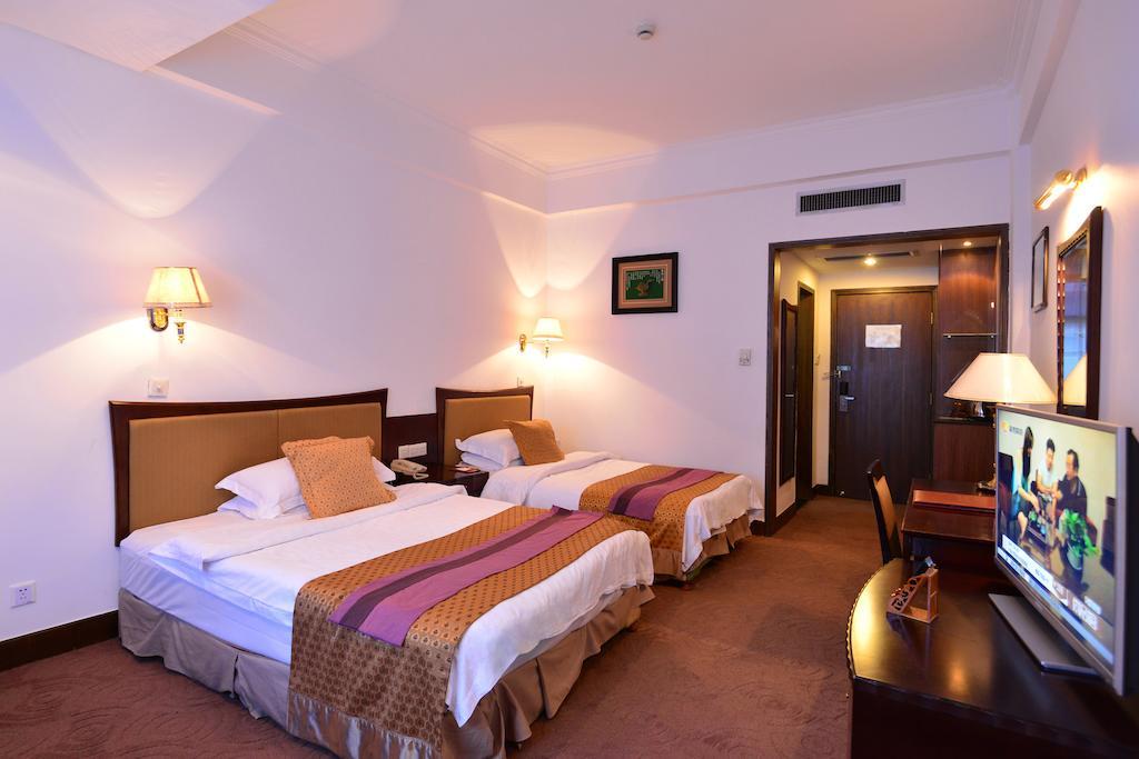 Baodao Exhibition Center Hotel Уйишань Номер фото