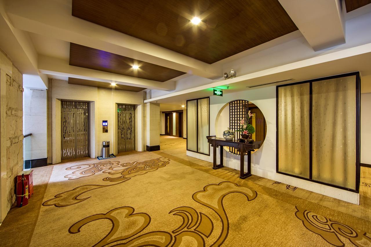 Baodao Exhibition Center Hotel Уйишань Экстерьер фото